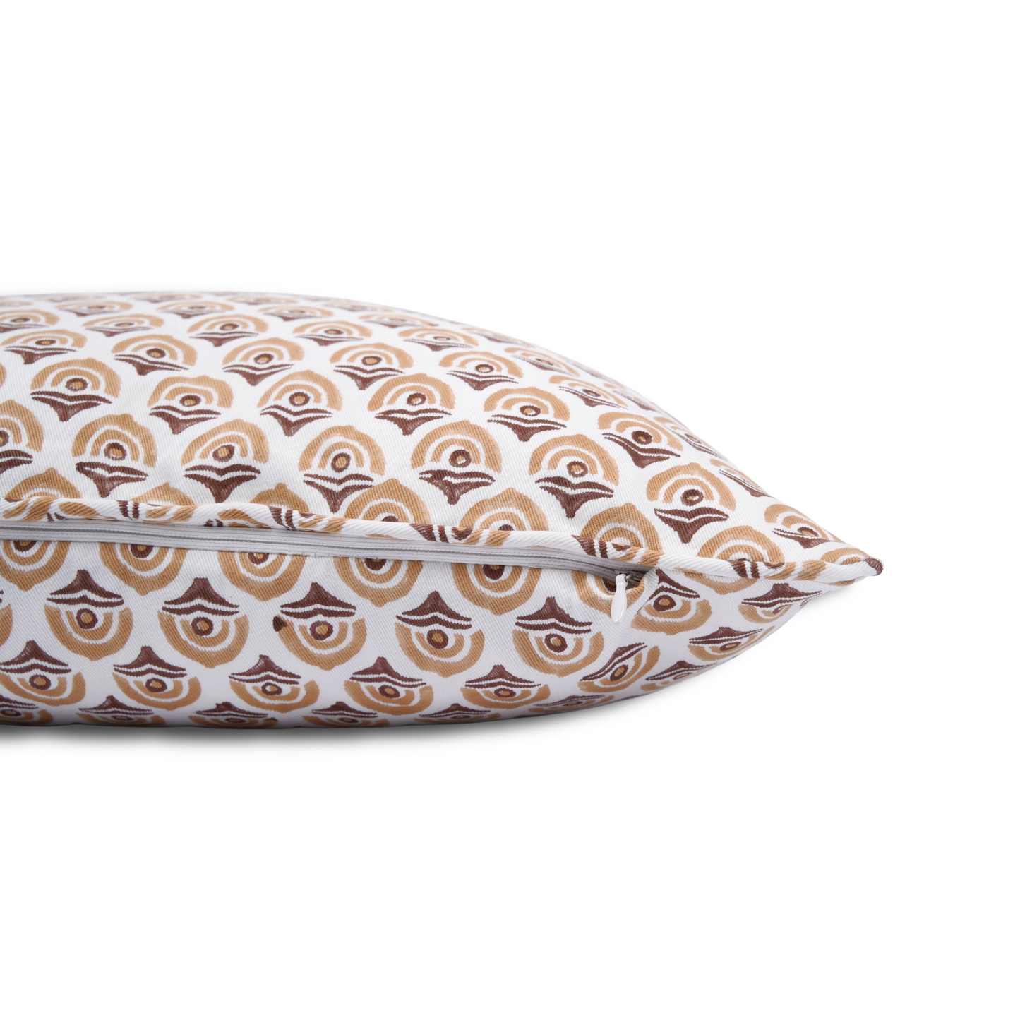 A close-up side view of a hand-block printed cushion featuring a warm ochre and earthy brown geometric arch pattern on a cream background. This detail shot highlights the neatly sewn discreet hidden zipper closure, showcasing the quality of this handcrafted textile that perfectly adds a cozy modern rustic Canadian farmhouse aesthetic to any home decor.