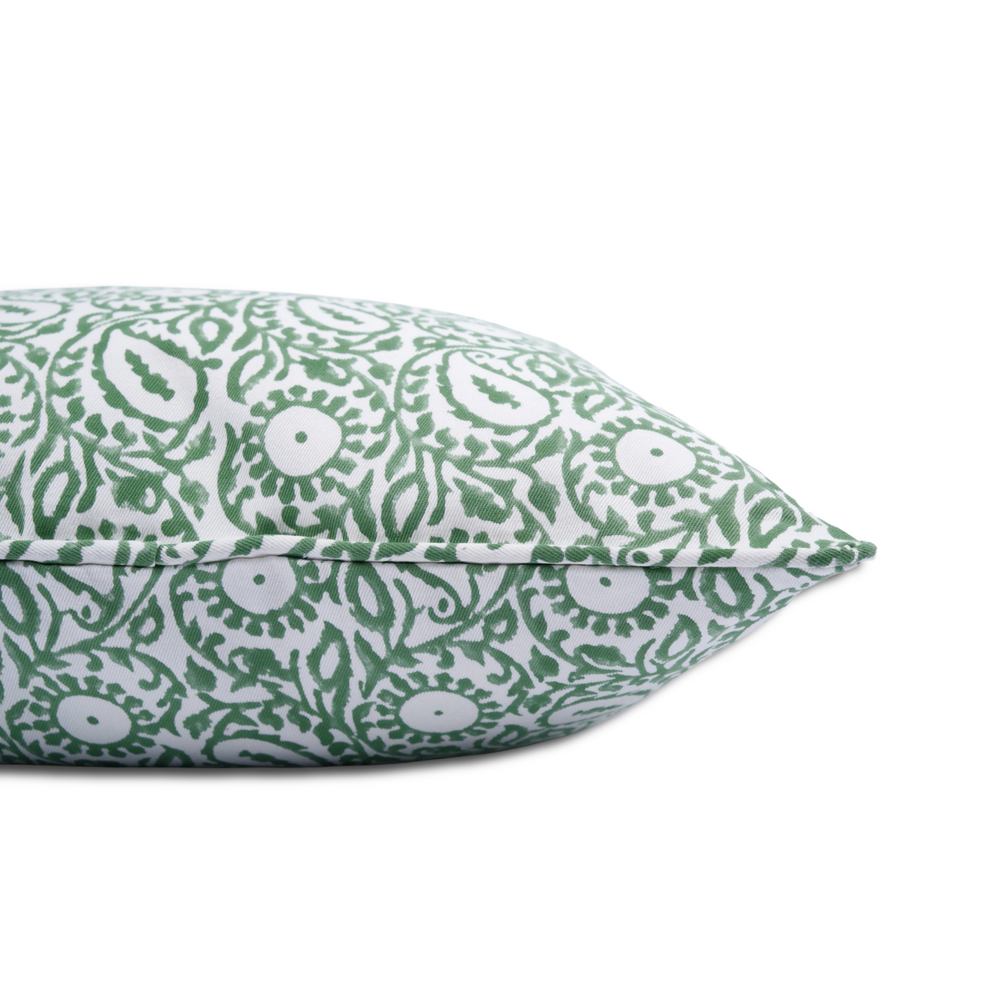 Close-up side view showing the hidden zipper closure and green piped seam of the Siona Scallion 100% cotton block printed pillow and cushion cover. Features an intricate scallion green paisley and floral botanical motif on white fabric, isolated on a white background.