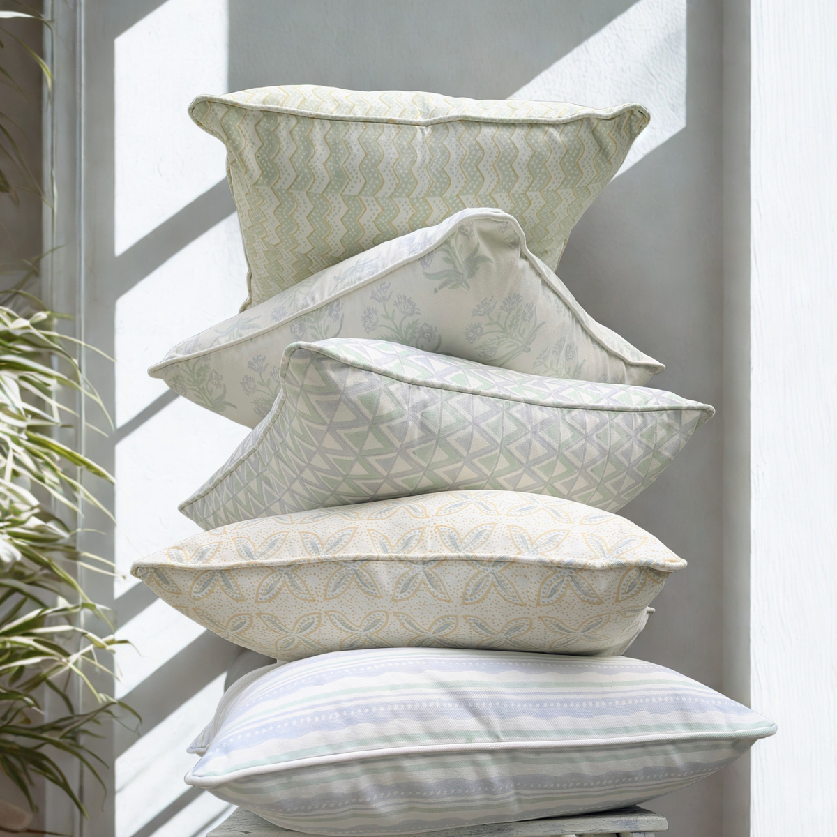 A vertical stack of five 100% cotton block printed pillow 