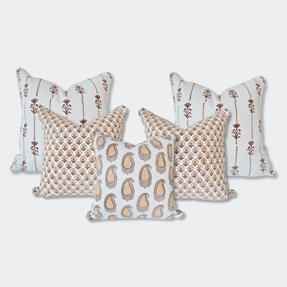 A curated set of five Homeway Living 100% cotton block-printed cushion covers on a light background. Features two back pillows with vertical brown floral motifs, two mid-layer pillows with an amber fan-arch pattern, and a front pillow with an amber paisley print. Finished with tailored piped edges, this artisan set offers a warm, high-end look ideal for modern rustic or Scandinavian home decor across Canada and the US.