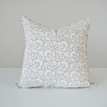 Square Fiora Muse 100% cotton block printed pillow cover. This artisan throw cushion features an intricate, dense floral botanical pattern in soft grey tones on a crisp white background with tailored piped edges. Fine handmade textile home decor.