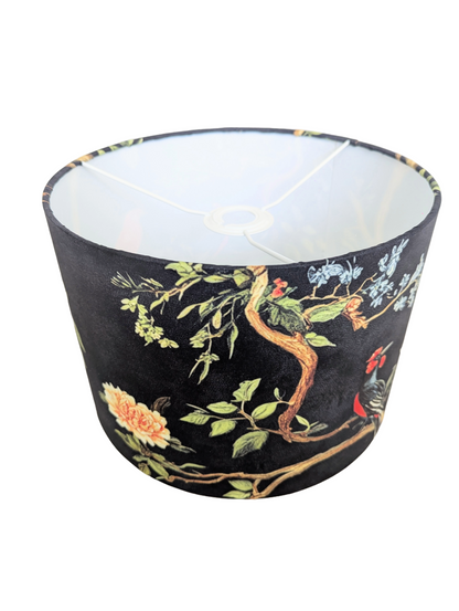 Decorative fabric printed lampshades with floral and bird pattern on a black background