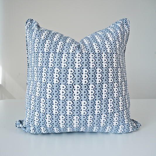 Studio product shot of a single Munnar Frost cushion cover by Homeway Living, centered on a neutral background. Handcrafted from 100% cotton, it features an intricate geometric chevron pattern in soft frost blue, navy, and white tones. Finished with tailored piped edges, this block-printed artisan piece offers a clean, high-end look ideal for modern rustic, coastal, or Scandinavian interiors.