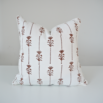 Square Reed Soil 100% cotton block printed pillow cover. This artisan throw cushion features a repeating earthy brown vertical dotted stripe and floral botanical motif on a crisp white background with tailored piped edges. Fine handmade textile home decor.