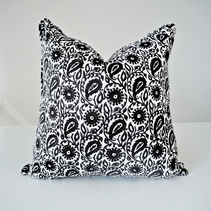 Square Siona Charcoal 100% cotton block printed pillow cover. This artisan throw cushion features a bold, intricate floral and paisley-inspired motif in charcoal black tones on a crisp white background, finished with tailored piped edges. Fine handmade artisan textile home decor.