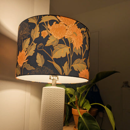 Lamp with floral-patterned shade with warm light