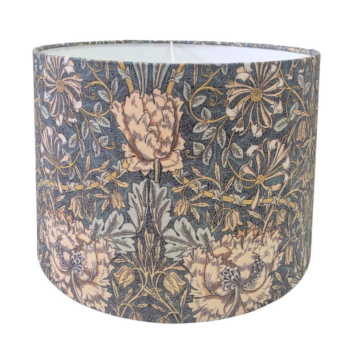 A drum lampshade featuring the classic William Morris Honeysuckle botanical pattern with peach flowers and green foliage on a dark background. This elegant vintage-style piece adds classic charm to a cozy modern rustic farmhouse aesthetic for both Canadian and USA home decor.