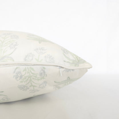 Close-up side view showing the hidden zipper closure and piped seam of the Jaipuri Breeze 100% cotton block printed pillow and cushion cover. Features a subtle sage green repeating floral stem motif on off-white fabric against a clean white background. Fine handmade artisan textile home decor.